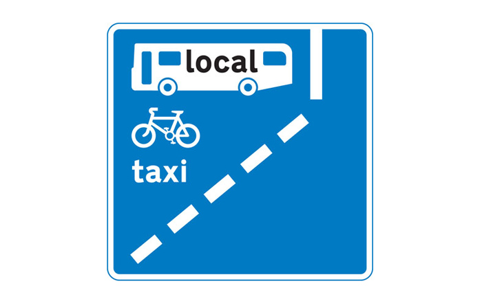 An example of a sign showing a bus lane where motorcycles are not allowed.