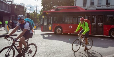 cyclists and bus