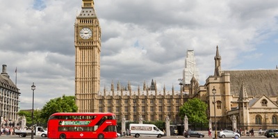 Red London bus in front of Houses of Parliament