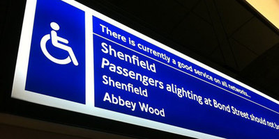 Accessibility information sign above platform edge door on Elizabeth line station