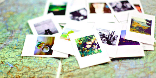 An assortment of photographs laid out on a paper map
