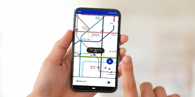 A phone displaying the TfL Go app