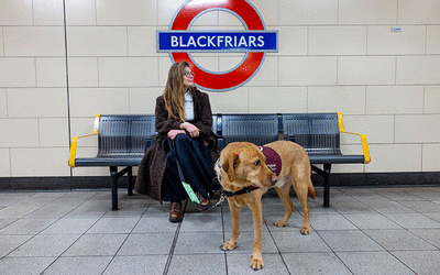 woman with assistance dog on Blackfriars Tube platform