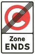 white rectangular road sign with red and white congestion charge logo crossed out and the text 'Zone ends' underneath